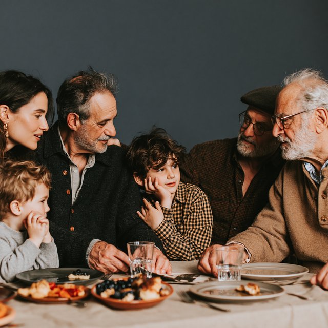 Lukeni multigenerational images, family meal, three generations at the table
